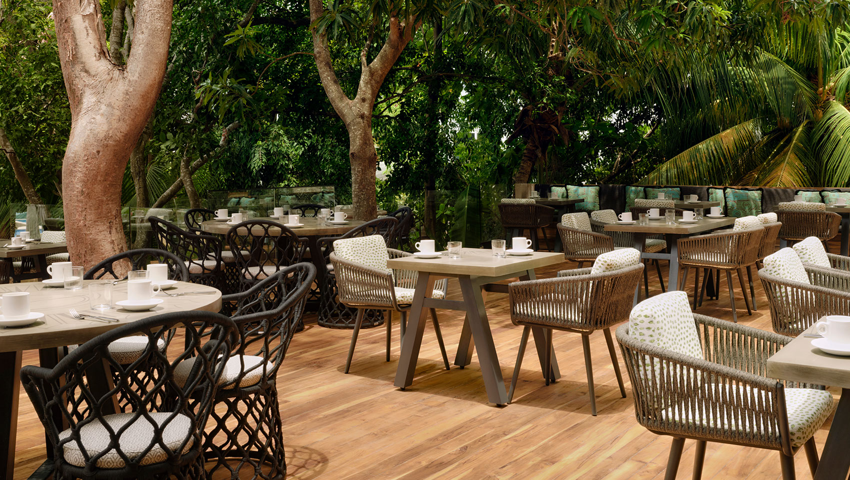 Picture of large outdoor table on alera patio covered in trees