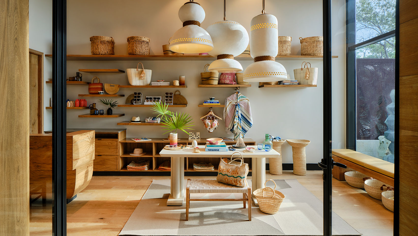 Entrance to retail shop showing table and shelves with retail items