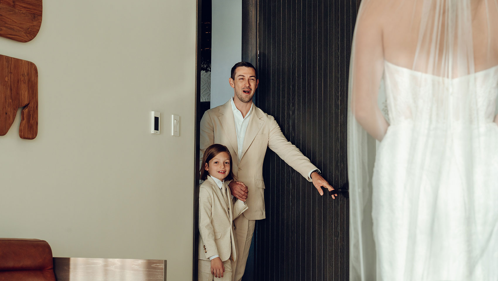 Groom and child get first look at the bride at Kimpton Grand Roatan