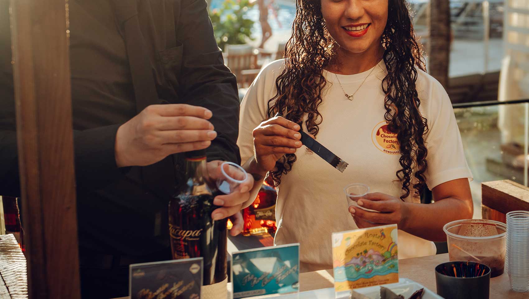 woman learns about rum at Kimpton Grand Roatan