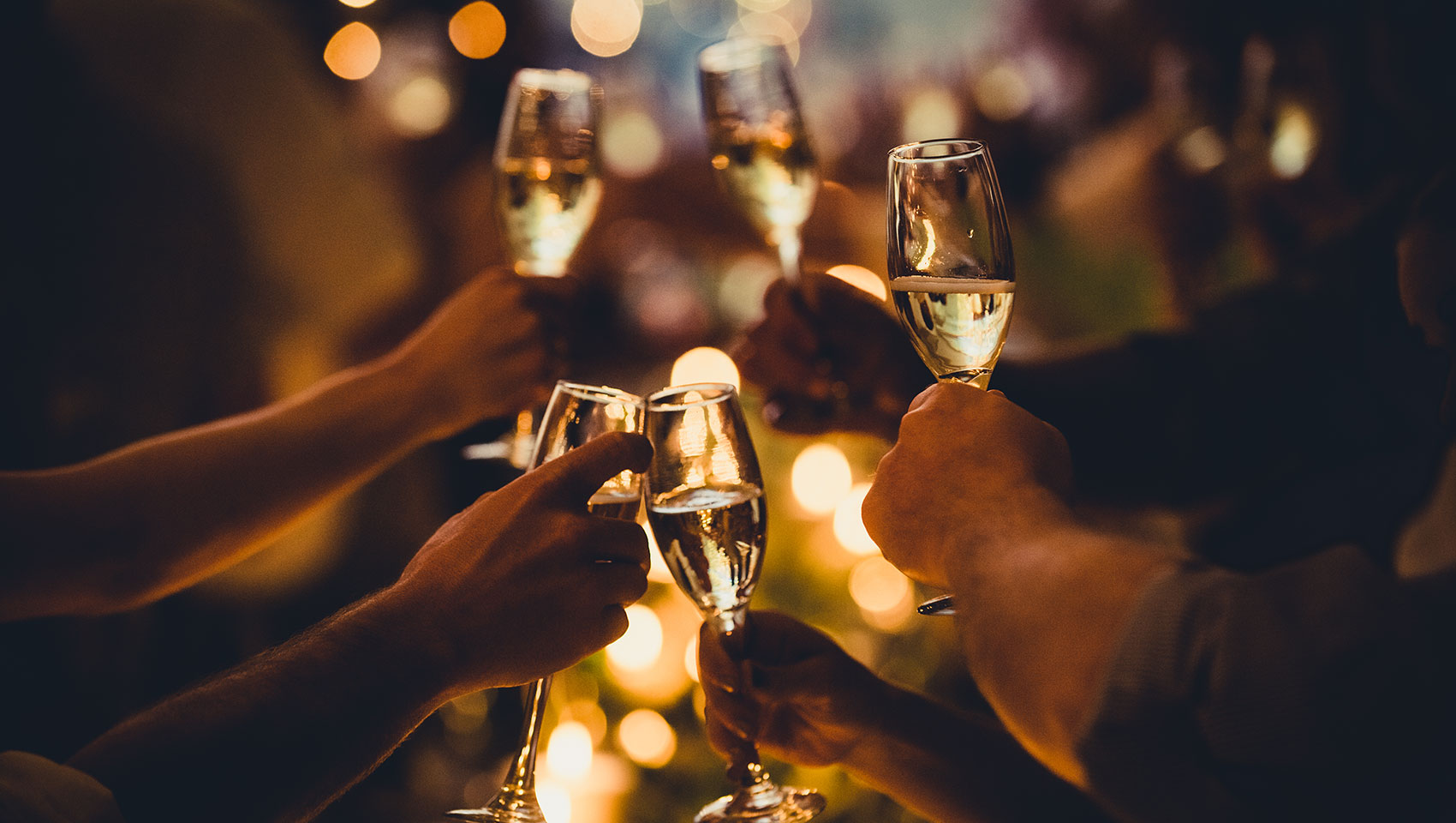 hands toasting champagne