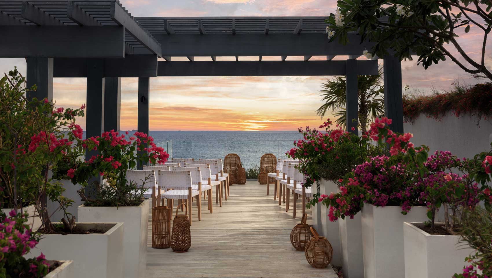 Outdoor Wedding ceremony set-up at sunset at Kimpton Grand Roatan on Balcony