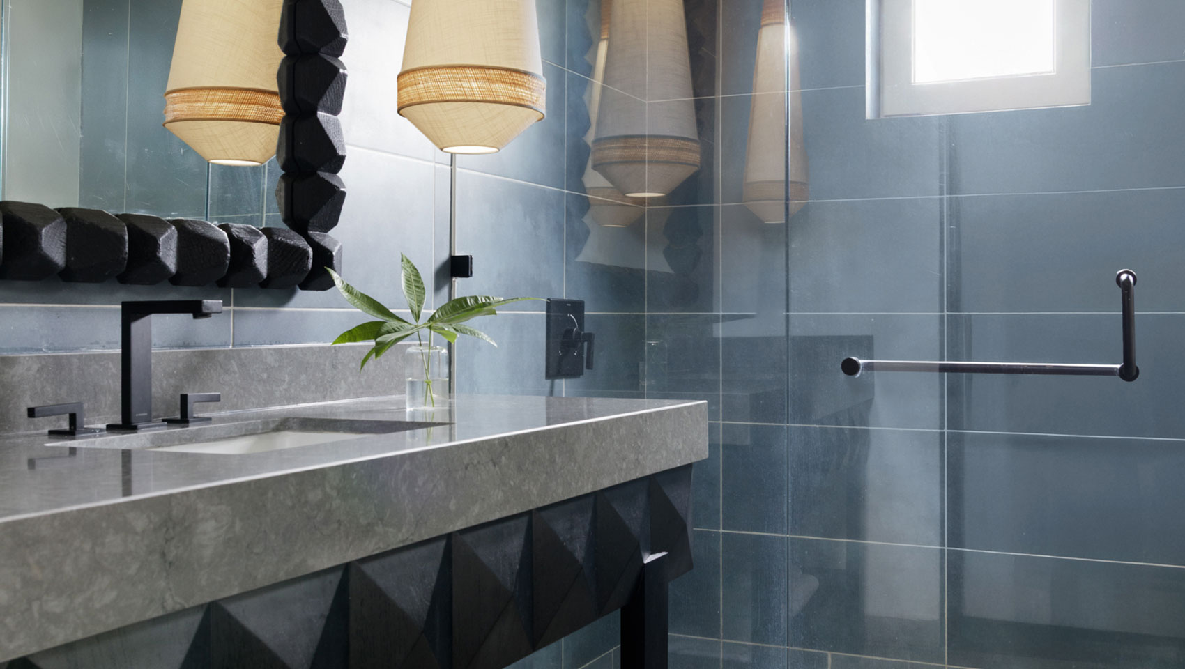 Bathroom sink and shower in One Bedroom Premium Villa Suite Beachfront at Kimpton Grand Roatan Resort