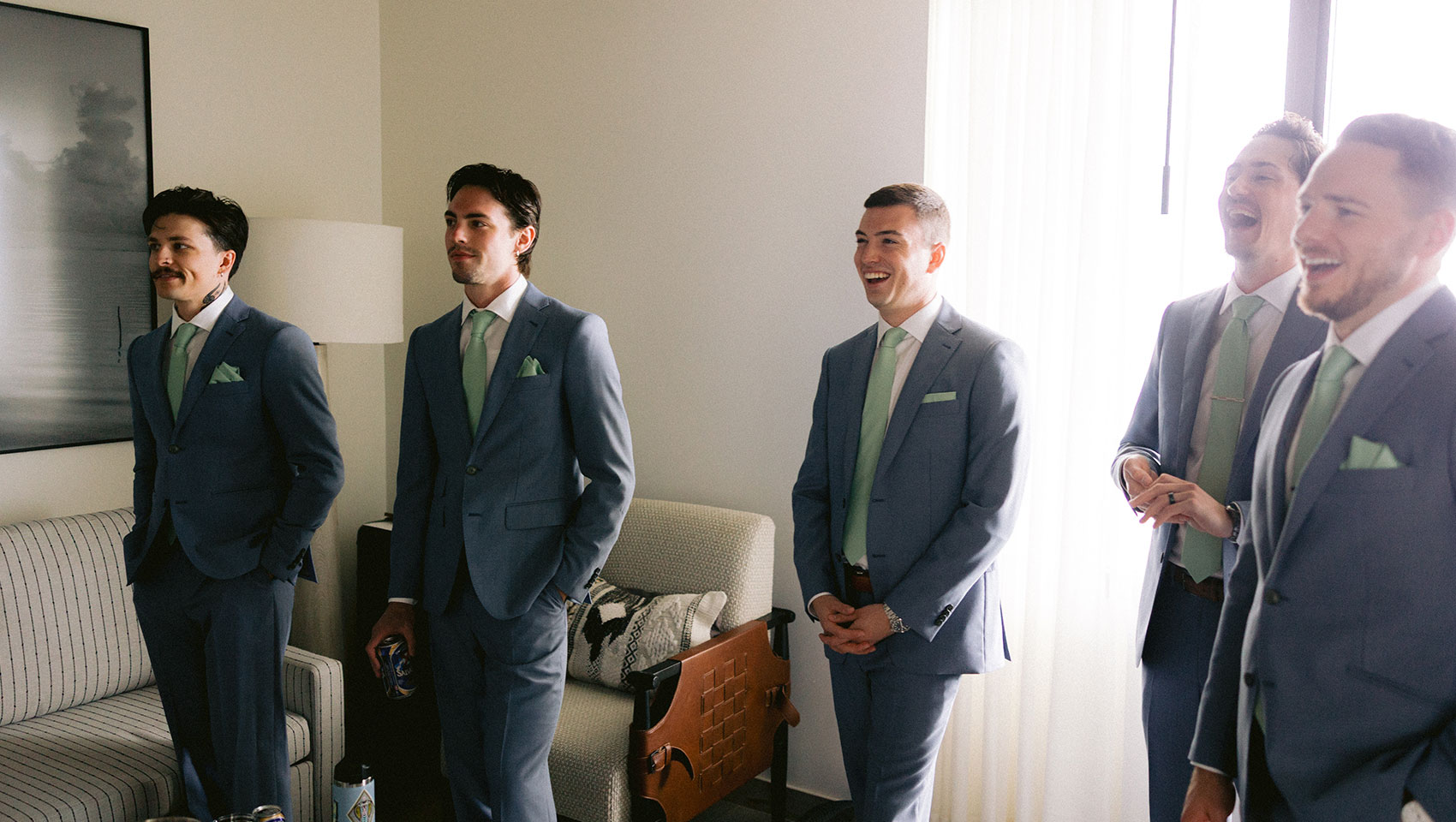 groomsmen in matching suits at Kimpton Grand Roatan