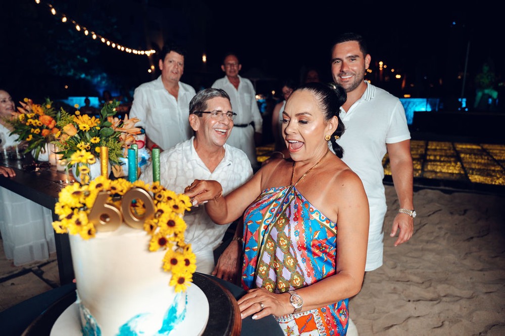 Bride and Groom on beach surrounded by a heart made of fire