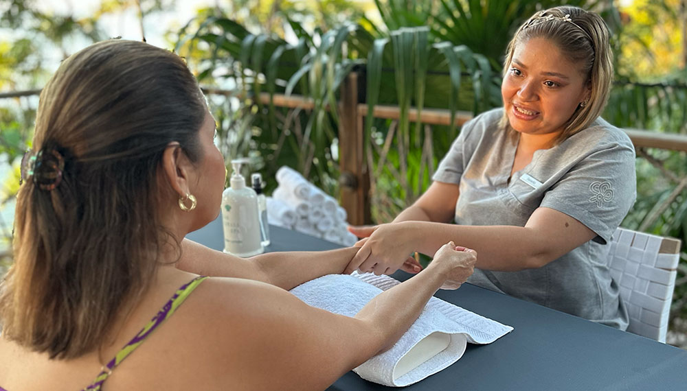 woman receiving a hand massage