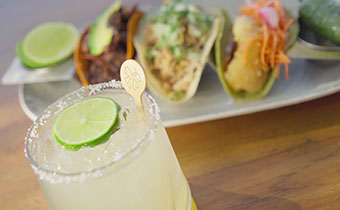 cocktail and tacos at Sea Cat