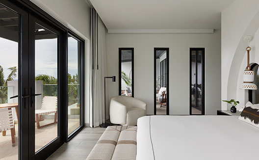 Four Bedroom Beachfront Penthouse bedroom with balcony view