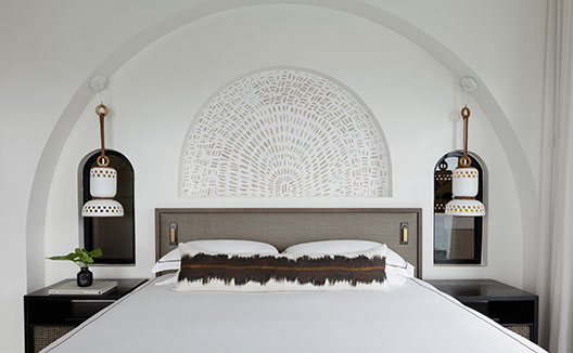 Four Bedroom Beachfront Penthouse bed and side tables