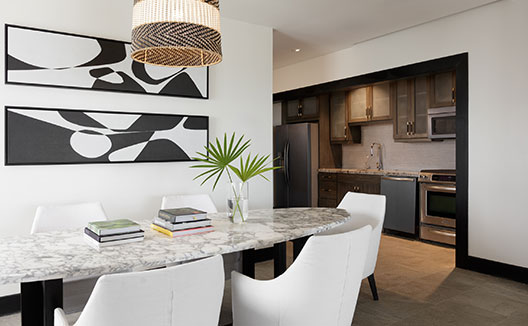 One Bedroom Premium Villa Suite dining area with kitchen view