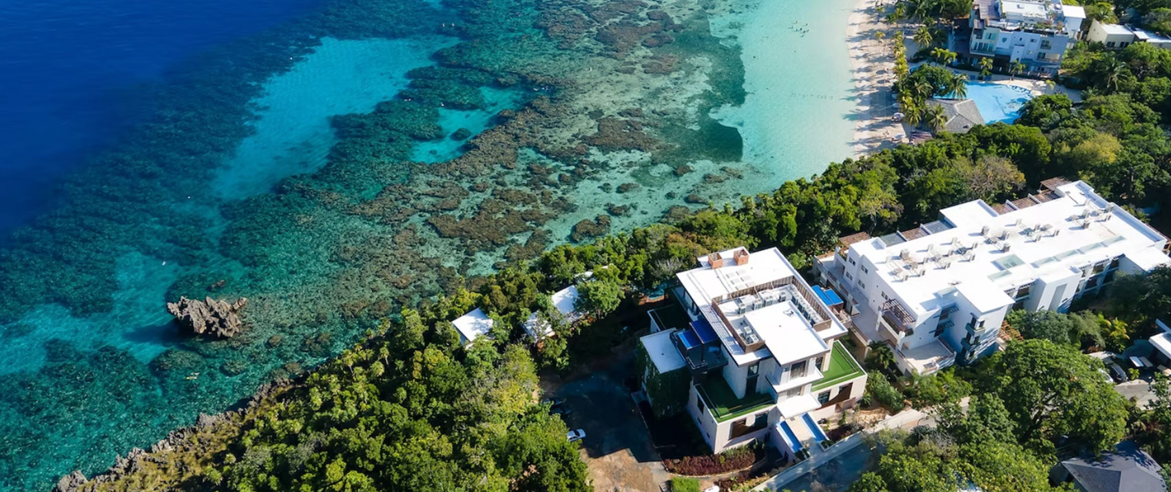 overhead view of a grand roatan beach shore